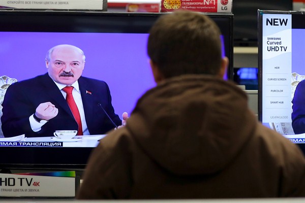 Belarus' president, Alexander Lukashenko, seen on TV screens criticizing Russian steps to stop the import of Belarusian products, Minsk, Feb. 3, 2017 (AP photo by Sergei Grits).