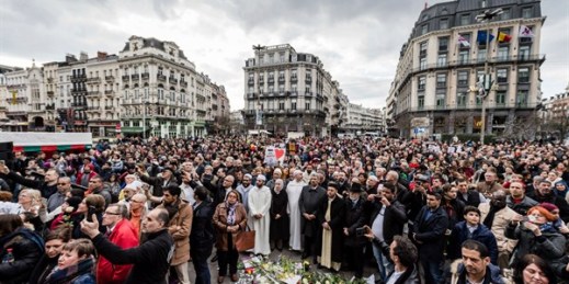 People stand for a moment of silence during the one-year anniversary of the Brussels attacks, Brussels, Belgium, March 22, 2017 (AP photo by Geert Vanden Wijngaert).