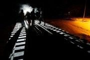 Migrants from Somalia cross into Canada from the United States, walking down a train track into the town of Emerson, Manitoba, where they will seek asylum, Feb. 26, 2017 (Canadian Press photo by John Woods via AP).