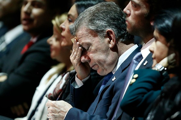 Colombia's president, Juan Manuel Santos, listens to Vice President German Vargas Lleras present an annual report in Bogota, March 14, 2017 (AP photo by Fernando Vergara).