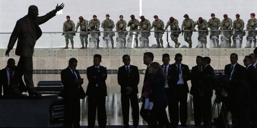 Security personnel guard the Unasur building during the Summit of the Community of Latin American and Caribbean States (CELAC), Quito, Ecuador, Jan. 27, 2016 (AP photo by Dolores Ochoa).