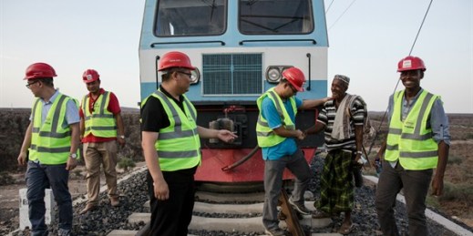 A local resident greets Chinese and African workers on the Addis Ababa–Djibouti railway during a trial run in Addis Ababa, Ethiopia, Sept. 28, 2016 (Imaginechina photo by Qin bin via AP).