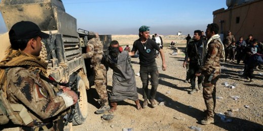Iraqi special forces arrest a fighter with Islamic State militia, Mosul, Iraq, Feb. 25. 2017 (AP photo by Khalid Mohammed).