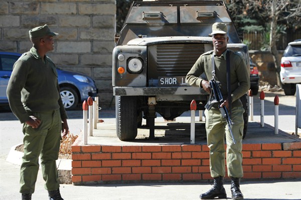 Army personnel outside the military headquarters in Maseru, Lesotho, after the country's prime minister fled to South Africa after what he called an attempted coup, Aug. 31, 2014 (AP photo).
