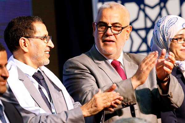 Morocco's current and former prime ministers, Saadeddine Othmani and Abdelilah Benkirane, applaud during a campaign meeting, Rabat, Morocco, September 25, 2016 (AP photo Abdeljalil Bounhar).