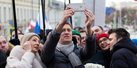 Russian opposition leader Alexey Navalny and his wife, Yulia, take a selfie during a march in memory of opposition leader Boris Nemtsov, Moscow, Russia, Feb. 26, 2017 (AP photo by Ivan Sekretarev).