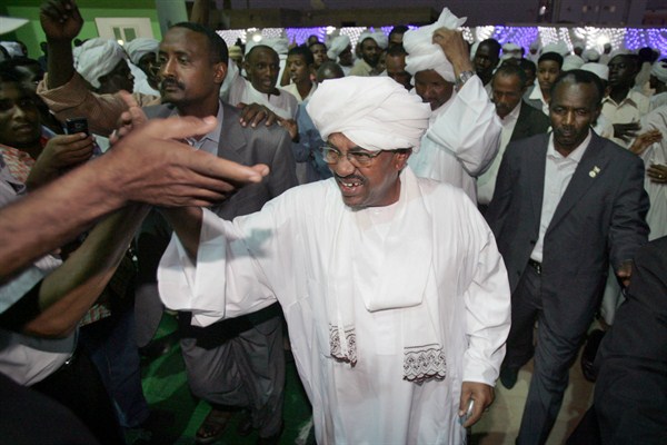 Sudanese President Omar al-Bashir is congratulated by supporters after winning another term in office, Khartoum, Sudan, April 26, 2010 (AP photo by Abd Raouf).