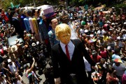 A giant puppet depicting U.S. President Donald Trump paraded at Carnival celebrations in Olinda, Pernambuco state, Brazil, Feb. 27, 2017 (AP photo by Diego Herculano).
