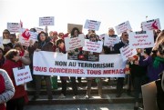 People demonstrate outside the Tunisian parliament with a banner reading "No to Terrorism," Tunis, Dec. 24, 2016 (AP photo by Ons Abid).