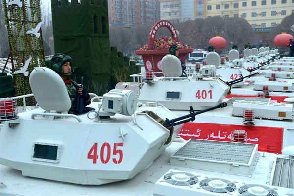 Chinese paramilitary force vehicles line up during an oath-taking ceremony, Xinjiang, China, February 17, 2017 (Imaginechina via AP Images).