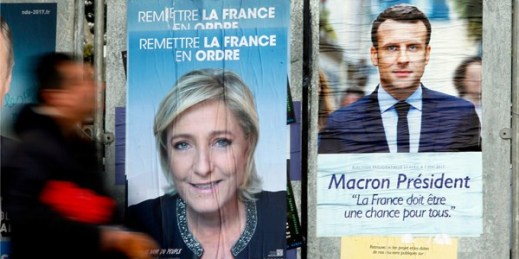Electoral posters of French centrist presidential candidate Emmanuel Macron and far-right candidate Marine Le Pen, Saint Jean de Luz, southwestern France, April 26, 2017 (AP photo by Bob Edme).