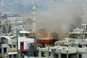 Smoke rises during a clashes that erupted between the Palestinian Fatah Movement and Islamists in the Palestinian refugee camp of Ein el-Hilweh, Lebanon, April 9, 2017 (AP photo by Mohammed Zaatari).