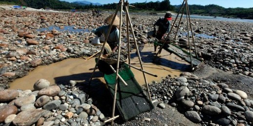 Members of Myanmar's Kachin ethnic group pan for gold in Myitsone, the proposed site of a controversial Chinese-backed dam (AP photo by Khin Maung Win).