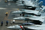 A row of F18 fighter jets on the deck of the U.S. Navy aircraft carrier USS Carl Vinson is prepared for patrols off the disputed South China Sea, March 3, 2017 (AP photo by Bullit Marquez).