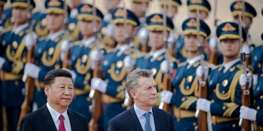 Chinese President Xi Jinping and Argentine President Mauricio Macri review an honor guard during a welcome ceremony at the Great Hall of the People, Beijing, May 17, 2017 (Pool photo by Nicolas Asfouri via AP).