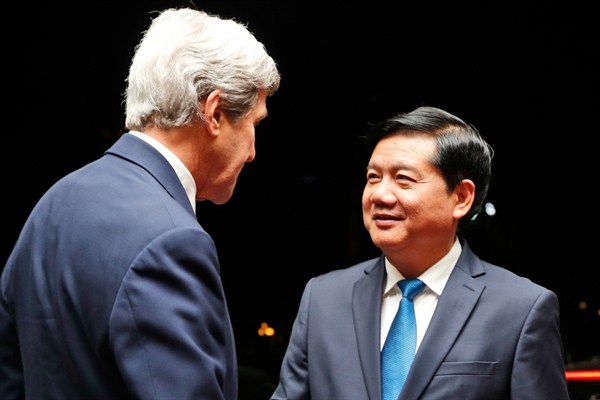 Dinh La Thang, who was recently dismissed from Vietnam’s Politburo, greets former U.S. Secretary of State John Kerry in Ho Chi Minh City, Vietnam, Jan. 13, 2017 (AP photo by Alex Brandon).