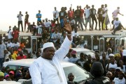 Gambian President Adama Barrow rides a motorcade after flying in from Senegal, where he took his oath of office abroad, Banjul, Gambia, Jan. 26, 2017 (AP photo by Jerome Delay).