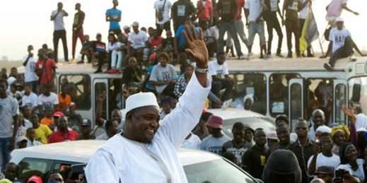 Gambian President Adama Barrow rides a motorcade after flying in from Senegal, where he took his oath of office abroad, Banjul, Gambia, Jan. 26, 2017 (AP photo by Jerome Delay).