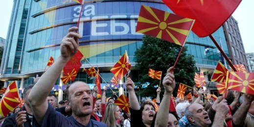 People wave Macedonian flags during a peaceful protest to demand new elections to try and break the country's political deadlock, Skopje, Macedonia, April 28, 2017 (AP photo by Boris Grdanoski).