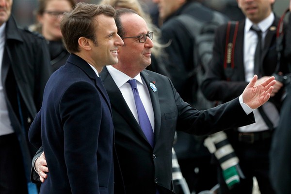 French President-elect Emmanuel Macron, left, and outgoing President Francois Hollande attend a ceremony to mark the end of World War II at the Arc de Triomphe in Paris, May 8, 2017 (Philippe Wojazer, pool via AP).