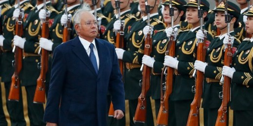 Malaysia's prime minister, Najib Razak, reviews an honor guard during a welcome ceremony, Beijing, Nov. 1, 2016 (AP photo by Andy Wong).
