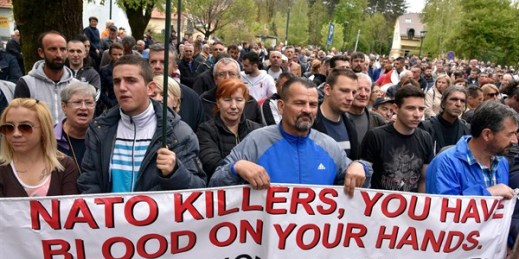 Anti-NATO demonstrators protest outside Montenegro's parliament during the vote to ratify membership, Cetinje, Montenegro, April 28, 2017 (AP photo by Risto Bozovic).