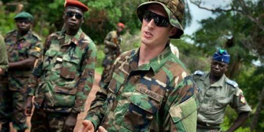 A U.S. Army Special Forces captain speaks with troops from the Central African Republic and Uganda searching for warlord Joseph Kony, Obo, Central African Republic, April 29, 2012 (AP photo by Ben Curtis).