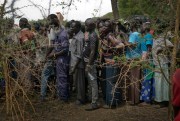 South Sudanese refugees line up at a supply distribution point after they arrive at their resettlement area at the Imvepi Camp, Uganda, April 4, 2017 (AP photo by Jerome Delay).