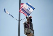 Workers hang Israeli and U.S. flags ahead of President Donald Trump's visit, Jerusalem, May 18, 2017 (AP photo by Sebastian Scheiner).
