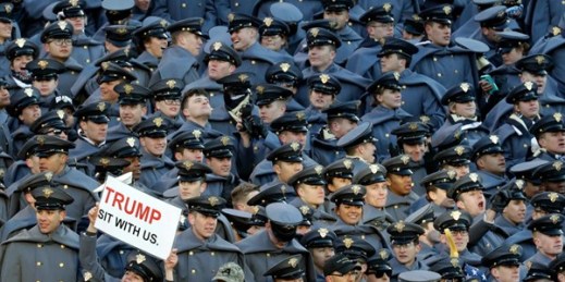 An Army Cadet displays a sign for then President-elect Donald Trump during the Army-Navy NCAA college football game, Baltimore, Saturday, Dec. 10, 2016 (AP photo by Patrick Semansky).