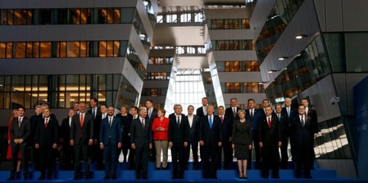 President Donald Trump poses with NATO leaders for a group photo at the new NATO headquarters, Brussels, May 25, 2017 (AP photo by Evan Vucci).