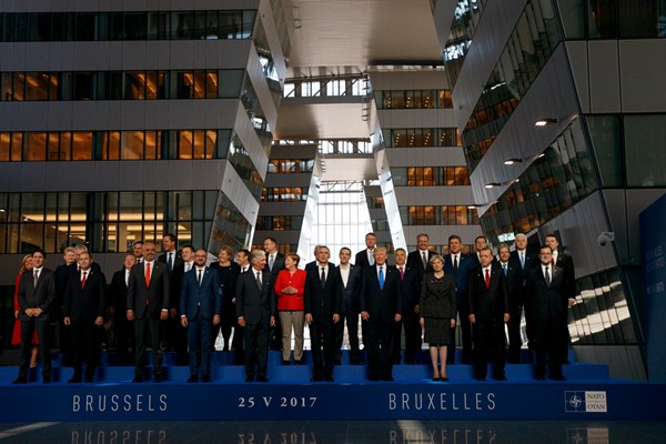 President Donald Trump poses with NATO leaders for a group photo at the new NATO headquarters, Brussels, May 25, 2017 (AP photo by Evan Vucci).