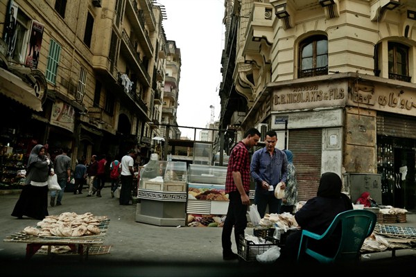 A woman sells bread near the Tawfiqia market, Cairo, Egypt, Oct. 18, 2016 (AP photo by Nariman El-Mofty).