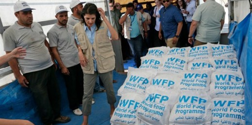 Nikki Haley, the U.S. ambassador to the U.N., walks past food parcels included as part of humanitarian aid shipments to Syria, during a visit to the border crossing in Reyhanli, southern Turkey, May 24, 2017 (AP photo by Burhan Ozbilici).