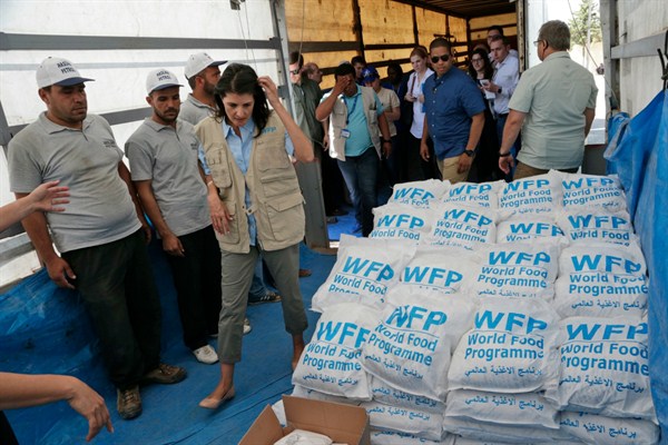 Nikki Haley, the U.S. ambassador to the U.N., walks past food parcels included as part of humanitarian aid shipments to Syria, during a visit to the border crossing in Reyhanli, southern Turkey, May 24, 2017 (AP photo by Burhan Ozbilici).