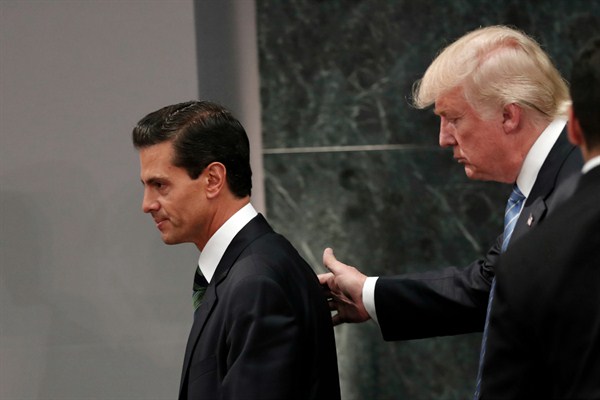 Mexican President Enrique Pena Nieto and then-Republican presidential nominee Donald Trump at the end of their joint statement at Los Pinos, the official presidential residence, Mexico City, Aug. 31, 2016 (AP photo by Dario Lopez-Mills).