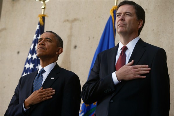 Former U.S. President Barack Obama and former FBI Director James Comey attend Comey’s installation ceremony at the FBI’s headquarters, Washington, Oct. 28, 2013 (AP photo by Charles Dharapak).
