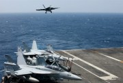 A U.S. Navy F-18 fighter jet lands on the aircraft carrier USS Carl Vinson following a patrol in the South China Sea, March 3, 2017 (AP photo by Bullit Marquez).