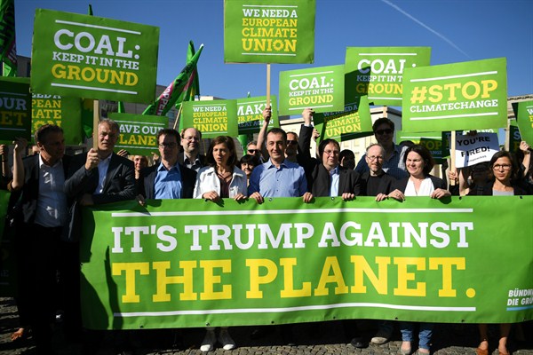 Parliamentary candidates of Germany's Green Party protest U.S. President Donald Trump's decision to exit the Paris climate agreement, in front the the U.S. Embassy, Berlin, June 2, 2017 (DPA photo by Britta Pedersen via AP).