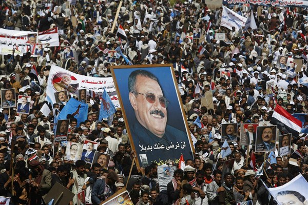 Supporters of former Yemeni President Ali Abdullah Saleh attend a rally marking one year of the Saudi-led coalition, Sanaa, Yemen, March 26, 2016. (AP photo by Hani Mohammed).