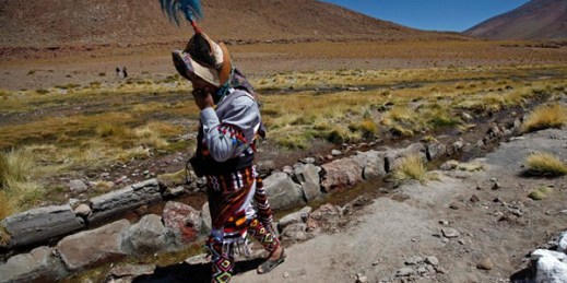 A Quechua indigenous person walks beside the stream of the Silala River, Potosi, Bolivia, March 28, 2013 (AP photo by Juan Karita).