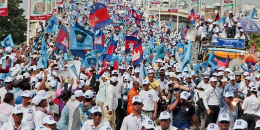 Supporters of the Cambodia National Rescue Party (CNRP) march ahead of communal elections, Phnom Penh, Cambodia, June 2, 2017 (AP photo by Heng Sinith).