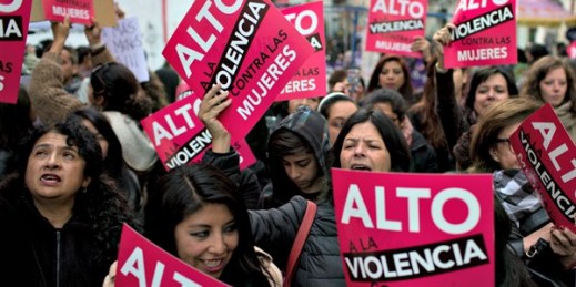 Activists with signs that read in Spanish, “Stop violence against women,” during a march against gender violence, La Paz, Bolivia, Oct. 19, 2016 (AP photo by Juan Karita).