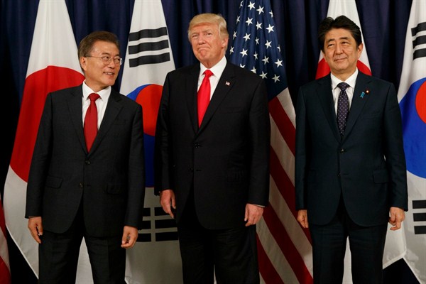 President Donald Trump meets with Japanese Prime Minister Shinzo Abe, right, and South Korean President Moon Jae-in before the Northeast Asia Security Dinner at the U.S. Consulate General in Hamburg, Germany, July 6, 2017 (AP photo by Evan Vucci).