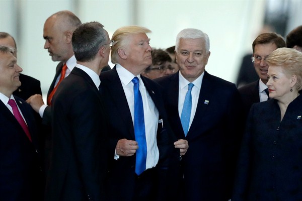 Donald Trump appears to push his way past Montenegro’s prime minister, Dusko Markovic, during a NATO summit in Brussels, May 25, 2017 (AP photo by Matt Dunham).