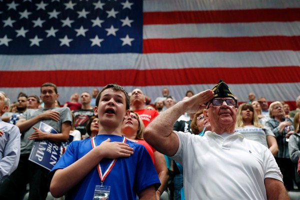 Supporters of President Donald Trump sing the Star Spangled Banner at a rally, Cedar Rapids, Iowa, June 21, 2017 (AP photo by Charlie Neibergall).