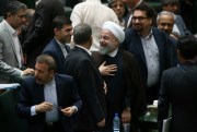 Iranian President Hassan Rouhani leaves parliament after speaking as part of a debate over his proposed Cabinet, Tehran, Aug. 15, 2017 (AP photo by Vahid Salemi).