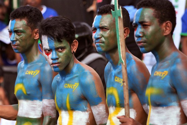 Supporters of CNRT Party have their face and body painted with the party's colors during a campaign rally, Dili, East Timor, July 17, 2017 (AP photo by Kandhi Barnez).