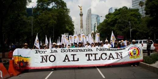 Farmers carry a banner that reads in Spanish "For national sovereignty, no to NAFTA!" during a march protesting the North American Free Trade Agreement, Mexico City, July 26, 2017 (AP photo by Rebecca Blackwell).