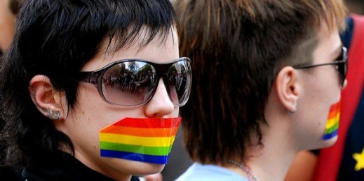 Gay rights supporters with their mouths covered with rainbow colored tape during a protest, Chisinau, Moldova, April 27, 2007 (AP photo by Dan Morar).